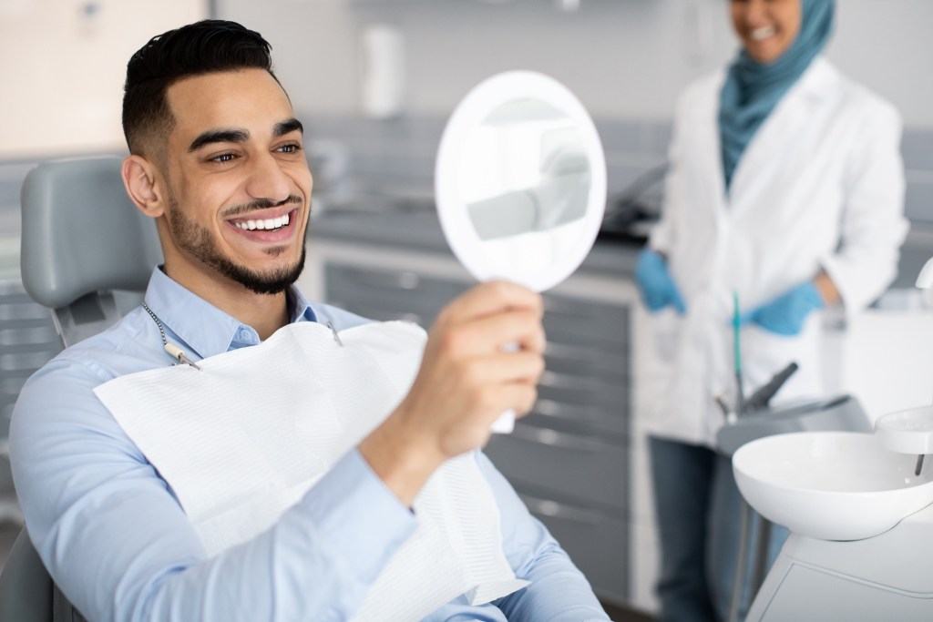 Man smiling after cosmetic treatment